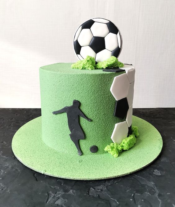 Cake with football and grass on it